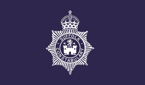 Official white crest of the Suffolk Constabulary on a dark purple background.